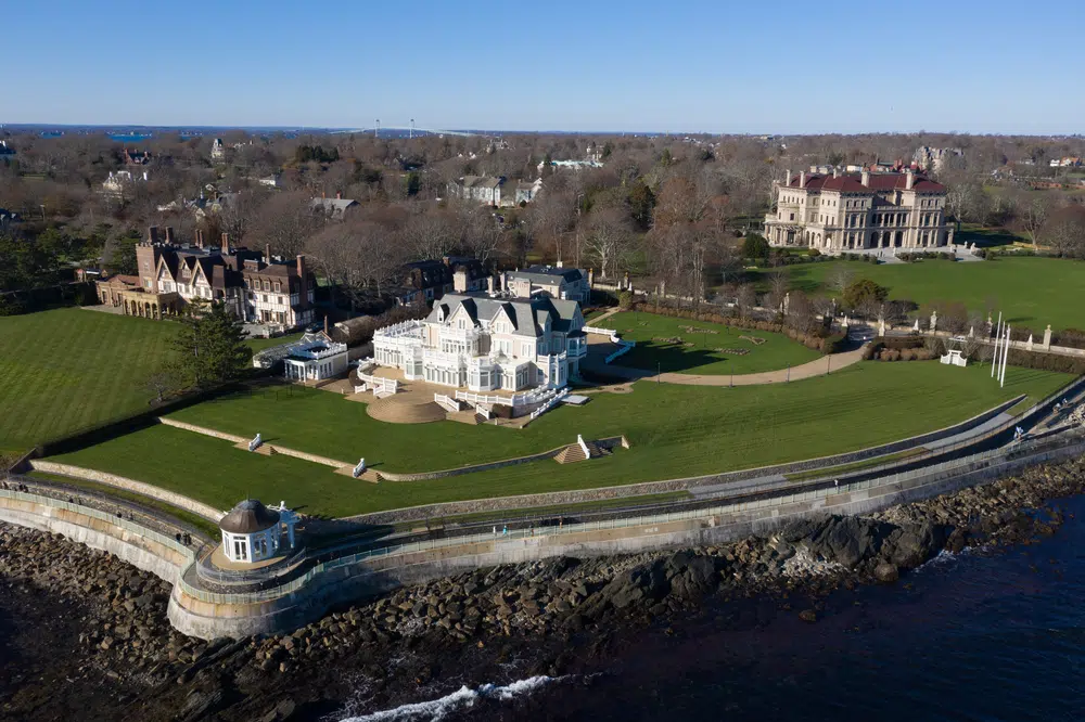 An aerial image of Newport, RI's Cliff Walk and the stunning Gilded Age Mansions in Newport